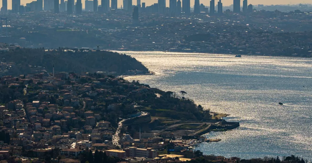 Aerial view of Istanbul cityscape with the Bosphorus shimmering in the background, showing modern skyline for Istanbul real estate investment 2026
