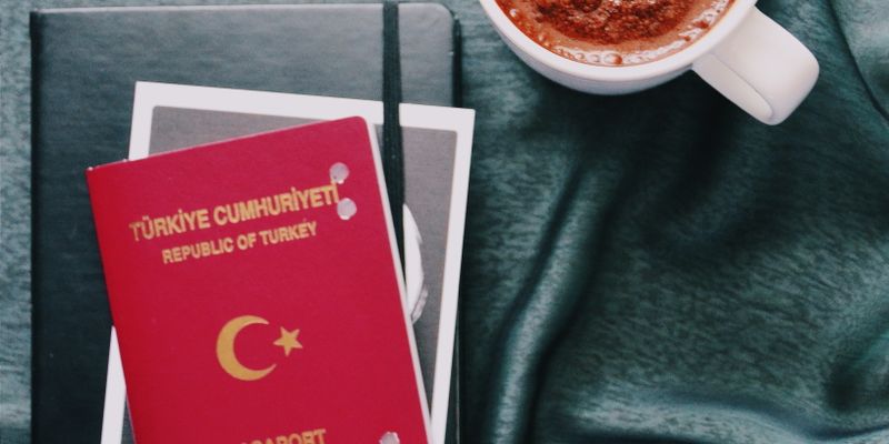 Turkish passport and travel documents representing Turkish citizenship by real estate investment 2026