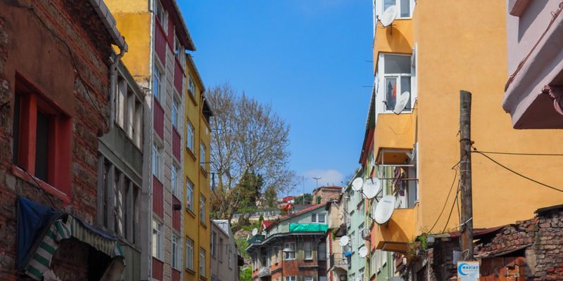 Vibrant street with colorful buildings in Istanbul showing residential district for property investment