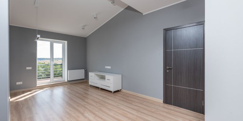 Modern empty apartment interior with hardwood floors showing rental property in Istanbul for yield investment